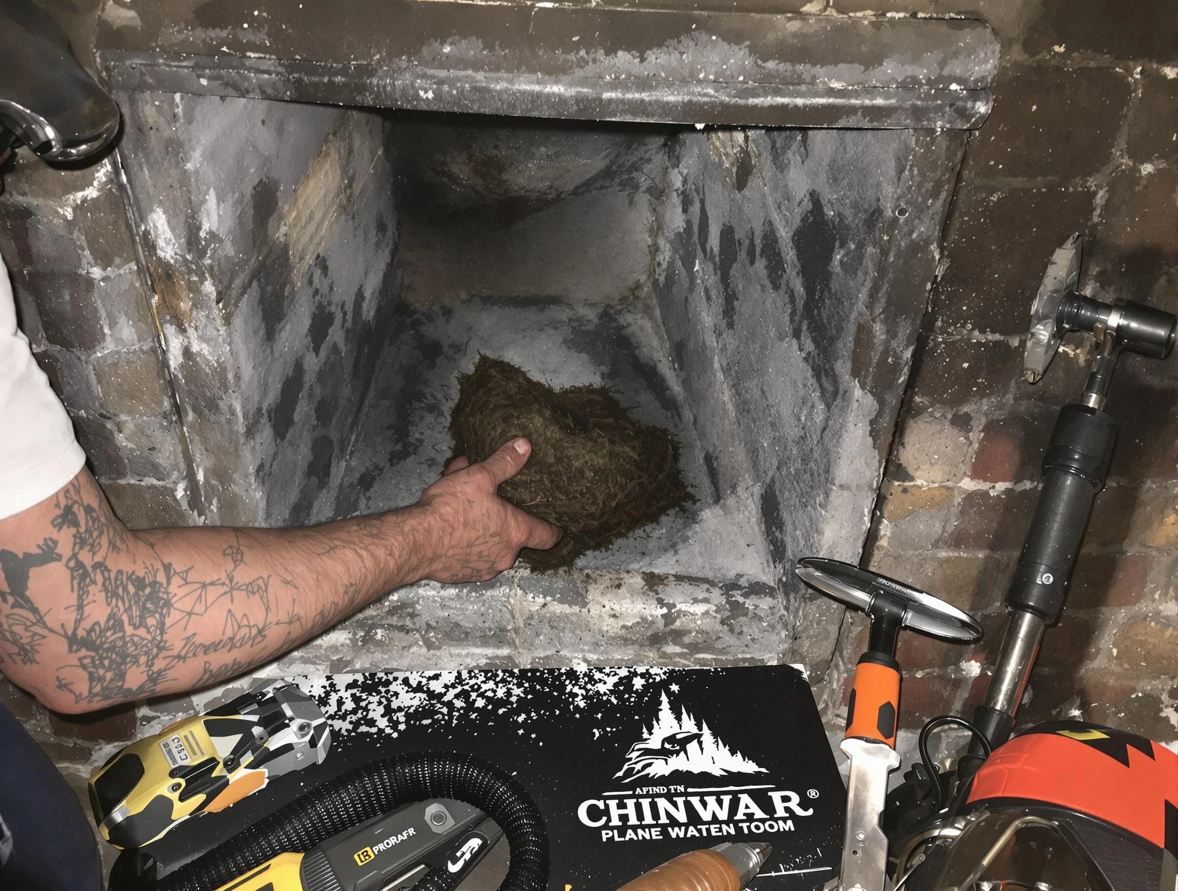 Johns Creek Chimney Sweep safely removing debris and screening chimney in Johns Creek, GA